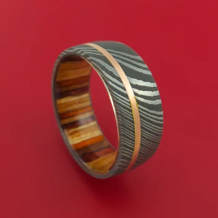 Damascus Steel Ring with 14k Rose Gold Inlay and Interior Hardwood Sleeve Custom Made Band Lashbrook Rings Damascus Steel Ring with 14k Rose Gold Inlay and Interior Hardwood Sleeve Custom Made Band Lashbrook Rings