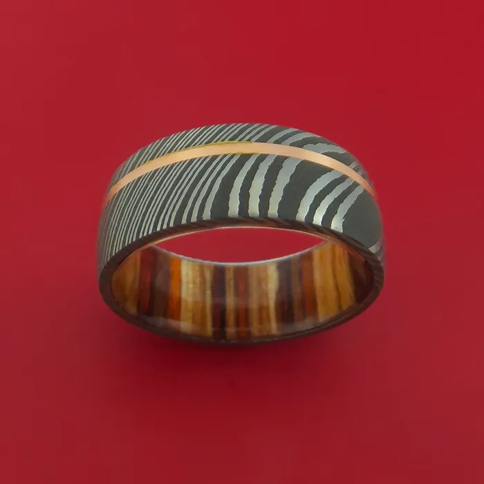 Damascus Steel Ring with 14k Rose Gold Inlay and Interior Hardwood Sleeve Custom Made Band Lashbrook Rings Damascus Steel Ring with 14k Rose Gold Inlay and Interior Hardwood Sleeve Custom Made Band Lashbrook Rings